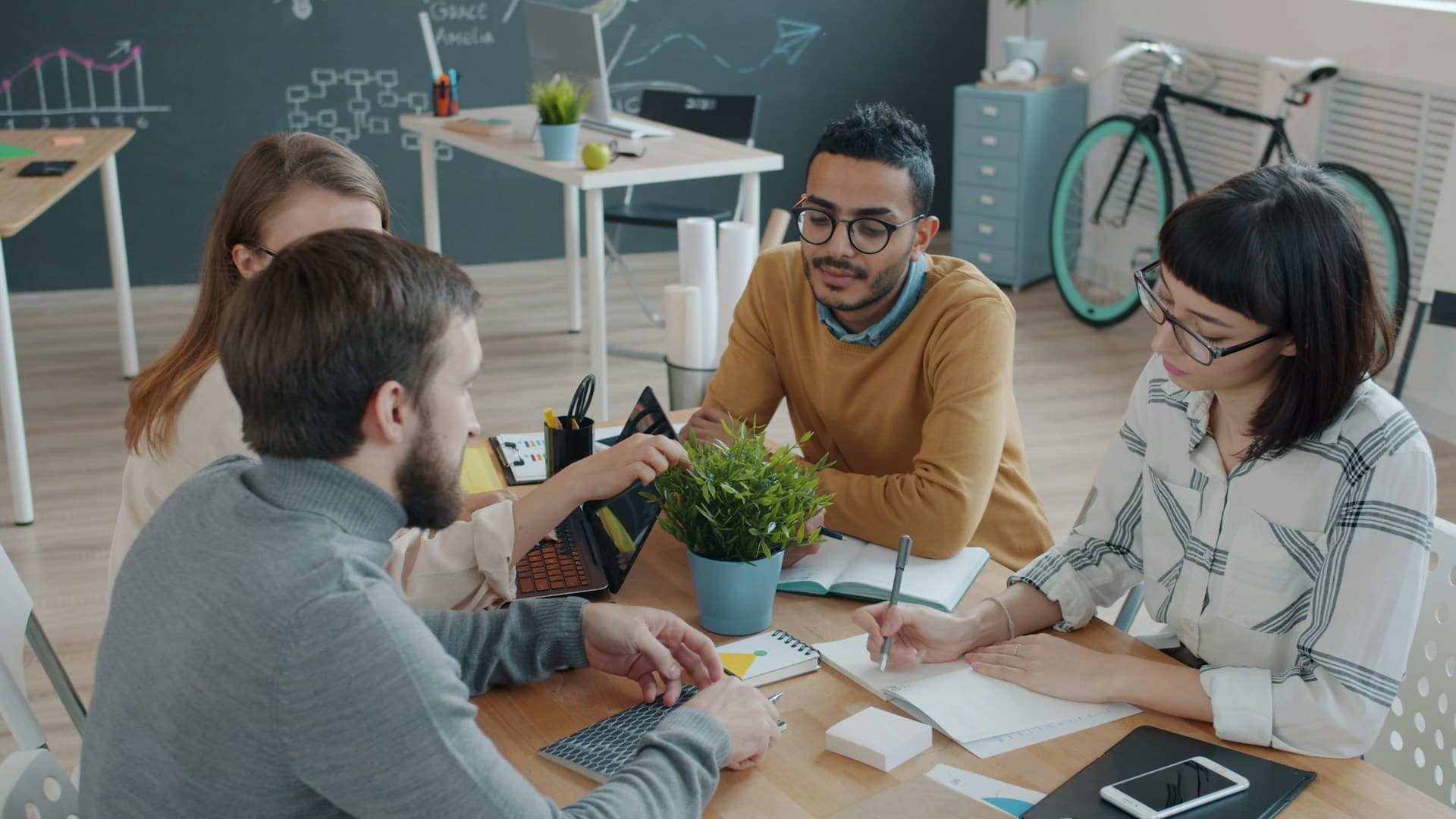Colleagues working together around a table